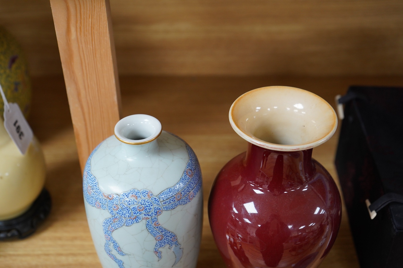 A Chinese sang de boeuf vase together with a celadon ground porcelain vase, Yongzheng mark but later. Condition - sang de boeuf good, celadon poor